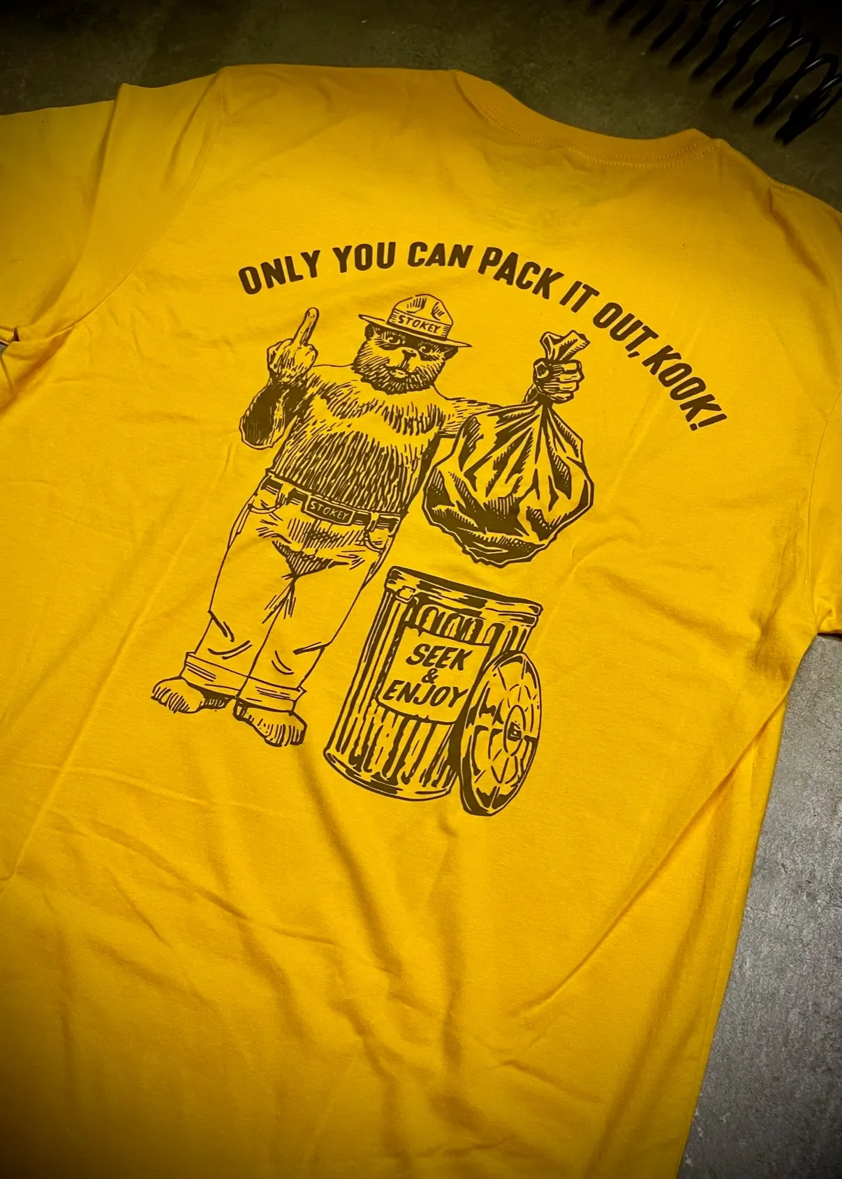 PACK IT OUT TEE | GOLD