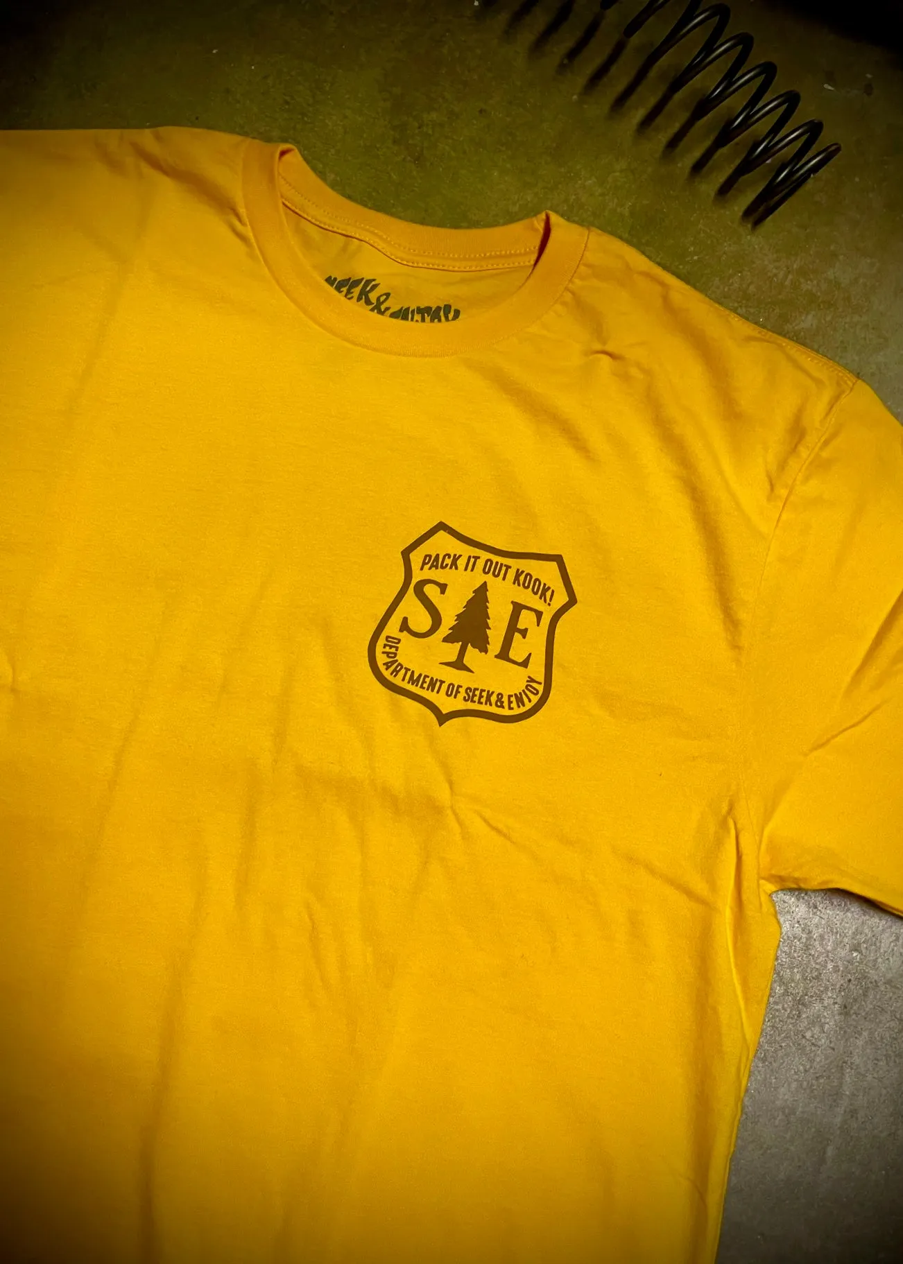 PACK IT OUT TEE | GOLD